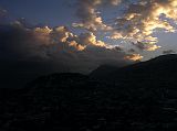 Ecuador Quito 07-04 Old Quito Cafe Mosaico Sunset View Of El Panecillo From Cafe Mosaico just after sunset, the clouds lit up beautifully in the evening sky with Old Quito and El Panecillo below.